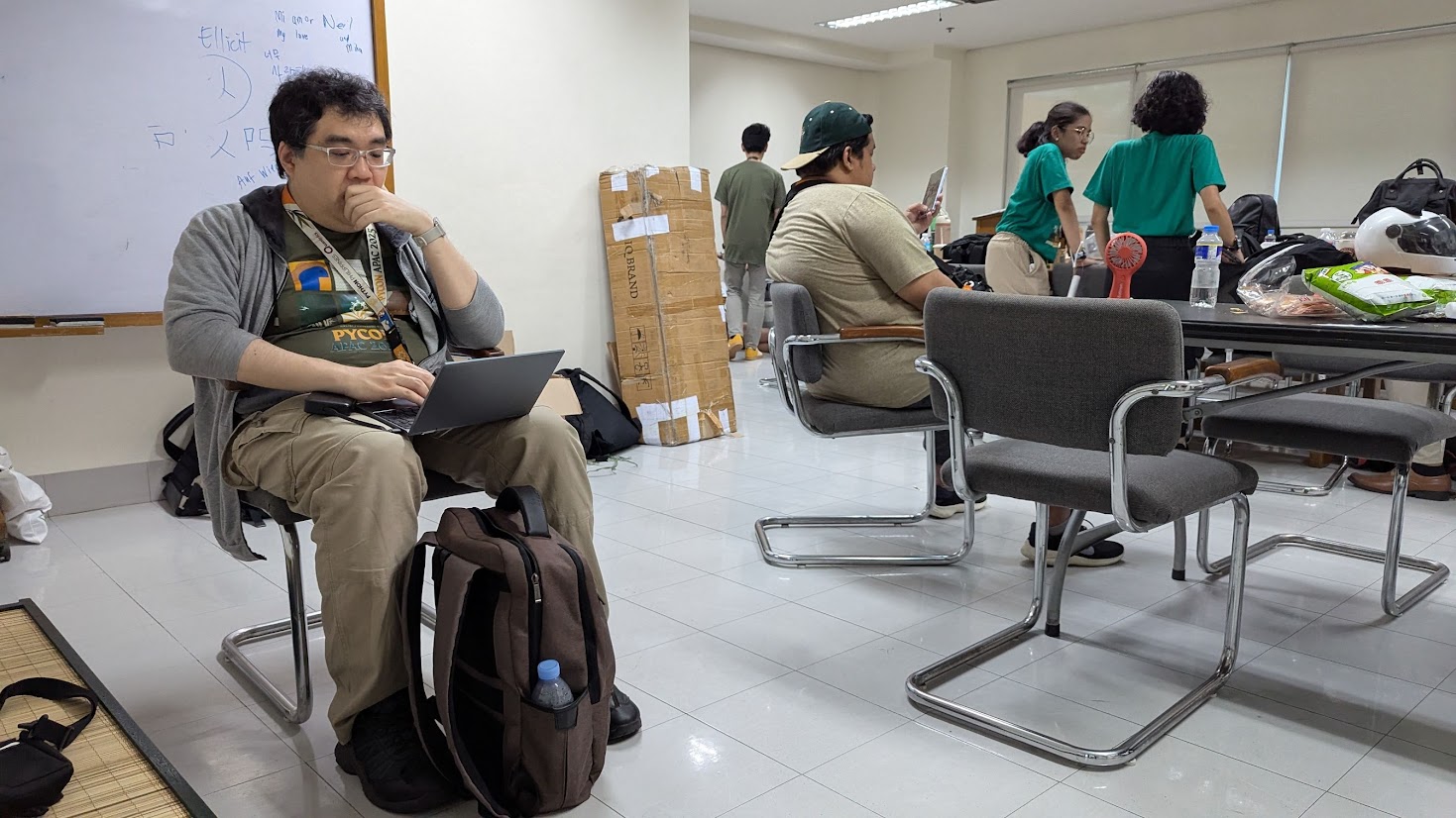 ../../../../_images/ph2025-day2-warroom-working.jpg